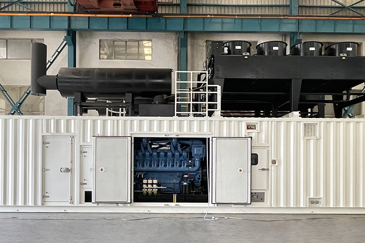 White containerised generator with its doors open, showing the engine inside