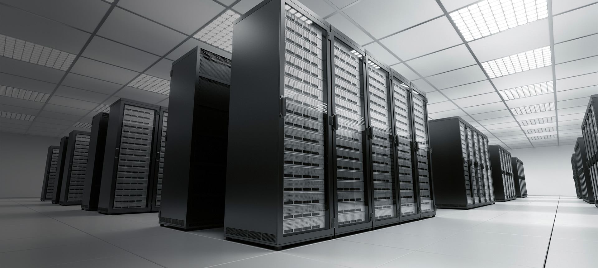 Rows of server racks in a bright data centre hall